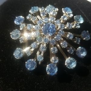 Baby blue rhinstone brooch in silver tone setting